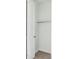 Empty walk-in closet featuring door, rod, and neutral carpet at 740 Meadowlark Dr, Erie, CO 80516