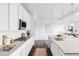 Modern, well-lit kitchen with stainless steel appliances, a kitchen island, and beautiful countertops at 740 Meadowlark Dr, Erie, CO 80516