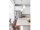 Bright, modern kitchen featuring a spacious island, stainless steel appliances, and pendant lighting at 740 Meadowlark Dr, Erie, CO 80516