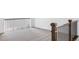 Carpeted landing with dark wood handrail and modern iron balusters provides a safe and stylish transition between floors at 740 Meadowlark Dr, Erie, CO 80516