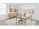 Bright office with a large window, wooden desk, and neutral decor at 740 Meadowlark Dr, Erie, CO 80516