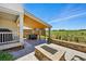 Beautiful outdoor patio with a fire pit, hot tub, and covered area for relaxation at 740 Meadowlark Dr, Erie, CO 80516
