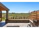 Expansive patio with stone fire pit, adjacent to open green space and walking path at 740 Meadowlark Dr, Erie, CO 80516