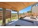 Spacious patio has a tongue and groove ceiling, heaters, and large fire pit at 740 Meadowlark Dr, Erie, CO 80516