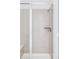 Contemporary tiled shower with glass door, built-in shelf, and modern fixtures at 740 Meadowlark Dr, Erie, CO 80516
