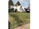 Charming home featuring a well-manicured front yard with trees and a welcoming wreath on the facade at 4780 Milwaukee St, Denver, CO 80216