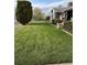 Well-maintained front lawn with lush grass and manicured landscaping enhances curb appeal at 4780 Milwaukee St, Denver, CO 80216