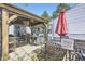 Backyard patio featuring an outdoor seating area with a grill and umbrella at 4780 Milwaukee St, Denver, CO 80216