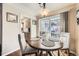 Cozy dining area featuring a chandelier and a view to the backyard at 4780 Milwaukee St, Denver, CO 80216