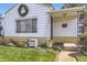 Cozy front porch featuring a wreath and manicured lawn at 4780 Milwaukee St, Denver, CO 80216