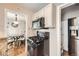 Kitchen view from dining area featuring black range and stainless refrigerator at 4780 Milwaukee St, Denver, CO 80216
