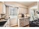 Bright kitchen with granite countertops, stainless steel sink and modern appliances at 4780 Milwaukee St, Denver, CO 80216