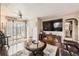 Living room with wood flooring, large windows and decorative art on the walls at 4780 Milwaukee St, Denver, CO 80216