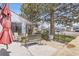 Charming patio with garden border and a view of the front yard and street at 4780 Milwaukee St, Denver, CO 80216
