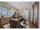 Home office with hardwood floors, a desk, and two chairs at 3914 Donnington Way, Castle Rock, CO 80104