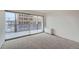 Balcony features sliding glass doors and cityscape views at 888 N Logan St # 4A, Denver, CO 80203