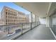 Spacious balcony with glass railings, offering city views and ample outdoor space at 888 N Logan St # 4A, Denver, CO 80203