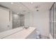 Bathroom with modern fixtures, large mirror and shower with glass door at 888 N Logan St # 4A, Denver, CO 80203