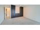 Cozy bedroom with carpeted floors and built-in black storage cabinets and drawers at 888 N Logan St # 4A, Denver, CO 80203