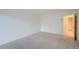 Spacious bedroom featuring neutral carpet and a door leading to the hall at 888 N Logan St # 4A, Denver, CO 80203