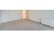 Bright bedroom features carpet and an open door to another room at 888 N Logan St # 4A, Denver, CO 80203