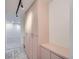 Hallway with overhead lights and built in closets, and marble floor at 888 N Logan St # 4A, Denver, CO 80203