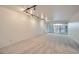 Inviting living room featuring carpeted floors, recessed lighting, and sliding glass doors to a balcony at 888 N Logan St # 4A, Denver, CO 80203