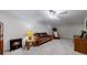 Cozy basement featuring a gas burning stove, carpet flooring, and comfortable seating area at 663 S Xenon Ct, Lakewood, CO 80228