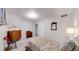 Bedroom with neutral paint and carpeting, and simple furnishings at 663 S Xenon Ct, Lakewood, CO 80228