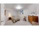 Bedroom with neutral paint and carpeting, and simple furnishings at 663 S Xenon Ct, Lakewood, CO 80228
