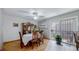 Bright dining area with wood table, chairs, and sliding door to patio at 663 S Xenon Ct, Lakewood, CO 80228