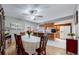 Dining room with six-chair dining set, view into the kitchen, and ceiling fan at 663 S Xenon Ct, Lakewood, CO 80228