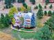 Stunning aerial view of a beautiful home surrounded by lush greenery and trees at 24768 Foothills N Dr, Golden, CO 80401