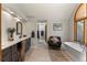 Bathroom featuring vanity, soaking tub, and lovely decor at 24768 Foothills N Dr, Golden, CO 80401