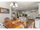 Open concept kitchen with white cabinets, an island, and breakfast nook at 24768 Foothills N Dr, Golden, CO 80401
