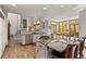 Open kitchen with a large island and breakfast bar near the dining area and living room at 24768 Foothills N Dr, Golden, CO 80401
