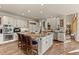 Bright kitchen with large island, breakfast bar, and modern appliances at 24768 Foothills N Dr, Golden, CO 80401