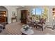 Sunlit living room featuring scenic outdoor views, plush seating, and tasteful decor at 24768 Foothills N Dr, Golden, CO 80401