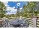 Inviting outdoor patio featuring a dining table with chairs with scenic views at 24768 Foothills N Dr, Golden, CO 80401