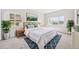 Inviting bedroom with a plush bed, decorative rug, and large windows offering views and plenty of light at 875 E 78Th Ave # 9-2, Denver, CO 80229