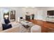 Living room featuring hardwood floors, a fireplace, and a sliding glass door to a patio at 875 E 78Th Ave # 9-2, Denver, CO 80229