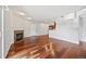 Spacious living room featuring a cozy fireplace, hardwood floors, and neutral-colored walls at 875 E 78Th Ave # 9-2, Denver, CO 80229