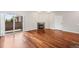 Living room with hardwood floors, a fireplace, and sliding glass door, that let in lots of light at 875 E 78Th Ave # 9-2, Denver, CO 80229