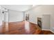 Spacious living room with hardwood floors, fireplace, and sliding glass door to the outside at 875 E 78Th Ave # 9-2, Denver, CO 80229