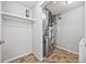 Utility room featuring updated furnace, tiled floors, and closet with shelving at 875 E 78Th Ave # 9-2, Denver, CO 80229