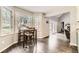 Dining area with big windows offering lots of natural light and picturesque wooded views at 4305 Red Rock Dr, Larkspur, CO 80118