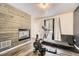 Workout space with a modern fireplace and exercise equipment at 4305 Red Rock Dr, Larkspur, CO 80118