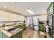 Bright kitchen with granite countertops, stainless steel appliances, and a central island at 4305 Red Rock Dr, Larkspur, CO 80118