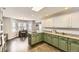 Modern kitchen featuring granite countertops, an island with cooktop, and adjacent breakfast nook at 4305 Red Rock Dr, Larkspur, CO 80118