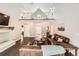 Bright living room featuring vaulted ceilings and a cozy fireplace, with access to a loft at 4305 Red Rock Dr, Larkspur, CO 80118